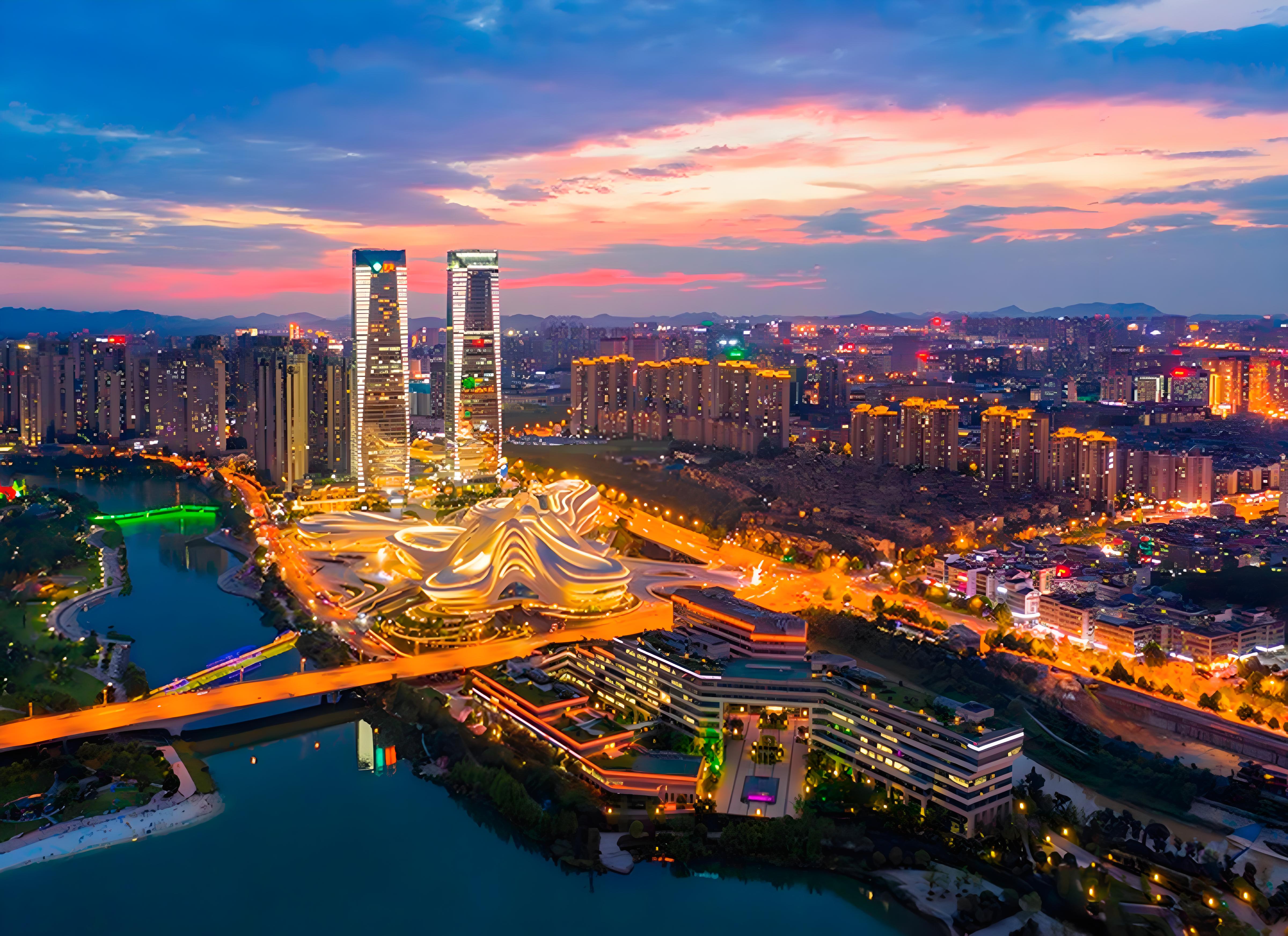 Modern skyline of Changsha city in Hunan province China showcasing urban development and green spaces with mountains in background
